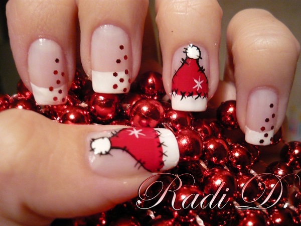Check out this wonderful Santa hat nail art. Be creative and paint on Santa hat French tips on your nails with stencil embellishments as cascading Christmas balls.