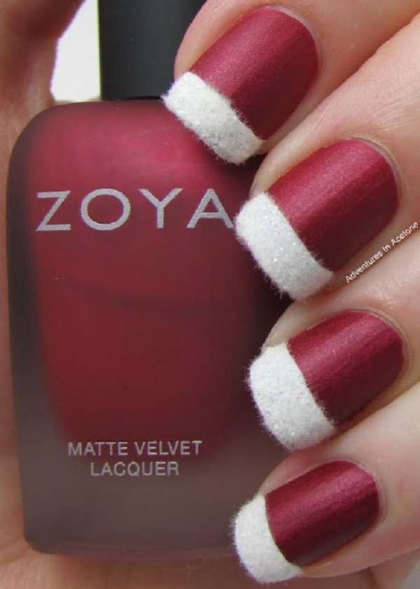 Take a peek at this very creative and classy Christmas nail art. Use a matte red color to fill the nails and add fur embellishments as French tips. Simple yet very eye catching design.