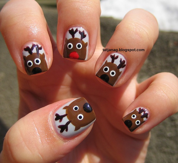 Adorable and cute reindeer inspired Christmas art. Draw various reindeers on your nails with huge cute eyes and a red nose for Rudolph.