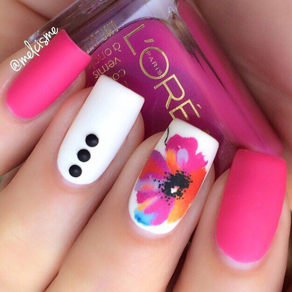 A gorgeous looking spring nail art design in pink and white polish. Create a matte effect on your nails with the pink and white polish and paint on an abstract colored on the other to stand out.