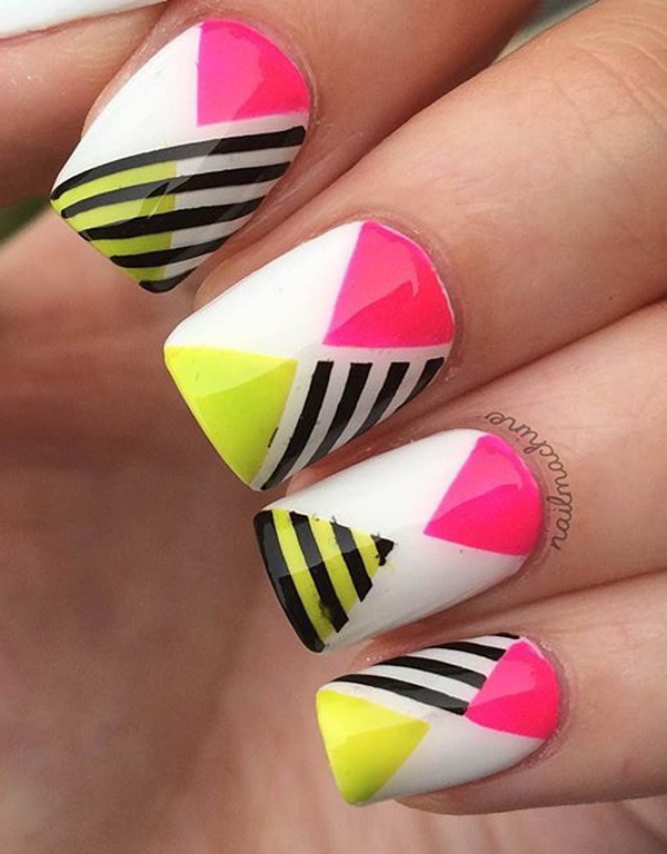 Amazing abstract themed spring nail art design. With help from vibrant colors such as yellow and pink with black and white stripes, your nails will look like they jumped out from a crazy party.