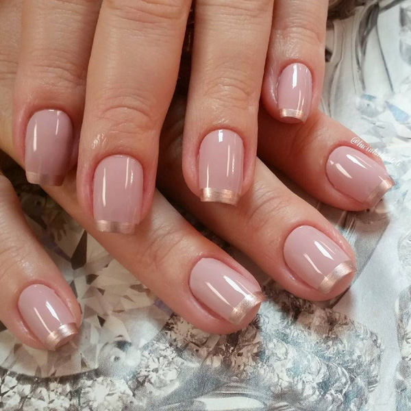 Elegant looking nude and gold spring nail art design. Make your nails look brand new and fresh with this nail art design and with the help of the gold glitter French tips.