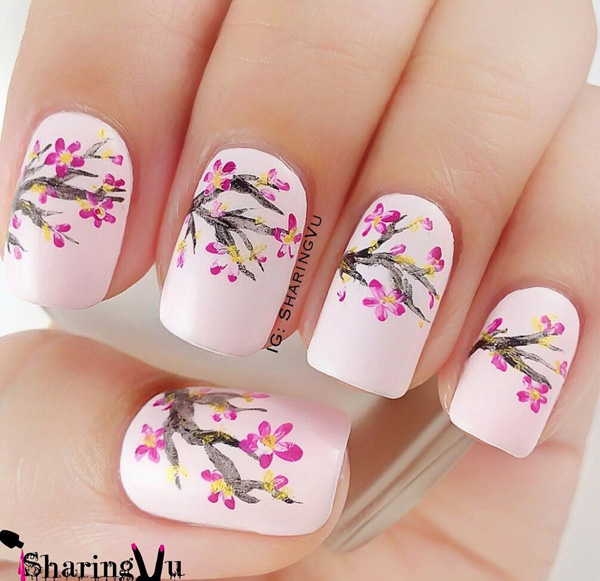 Beautiful cherry blossom spring nail art design. Spring is the time when cherry blossoms come about and what better way than to recreate them on your own nails.