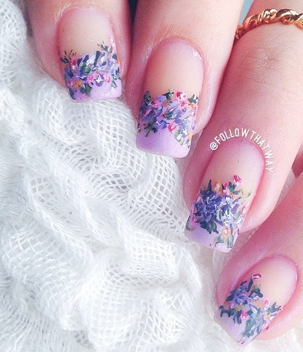 Flower inspired French tip spring nail art design. The flowers are in periwinkle theme and are crowning the French tips making your nails look really pretty and cute.