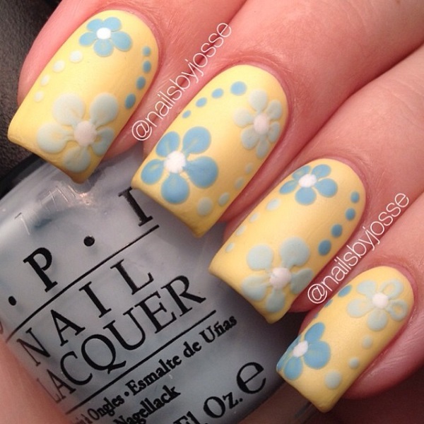 A really cute and light spring nail art design. Play along with baby blue and yellow colors as you paint on polka dots and flowers unto each nail.