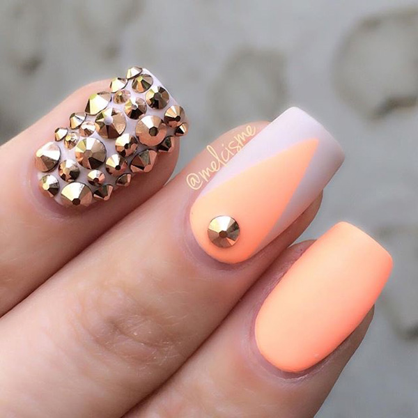 White and melon theme spring nail art design. Combine the bright melon polish with white nail polish to create that fresh look. You can even add gold stud embellishments on top for accent.