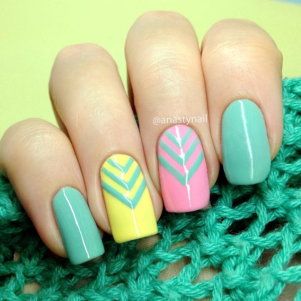 Candy colored spring nail art design. Simple yet very eye catching. Choose your favorite bright spring colors and add simple v-shaped details near the cuticle for effect.