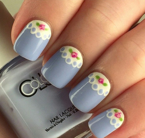 Gray blue lace inspired spring nail art design. The lace design combined with the spring theme is simply perfect. Make your nails look absolutely cute by adding pretty pink roses near the cuticle.