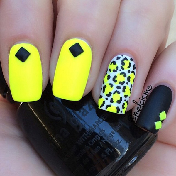 Bright yellow and black leopard nail art design. The contrasting colors of this design are absolutely stunning. You can definitely see the power that the visual effect holds and this design can be truly a stunner.