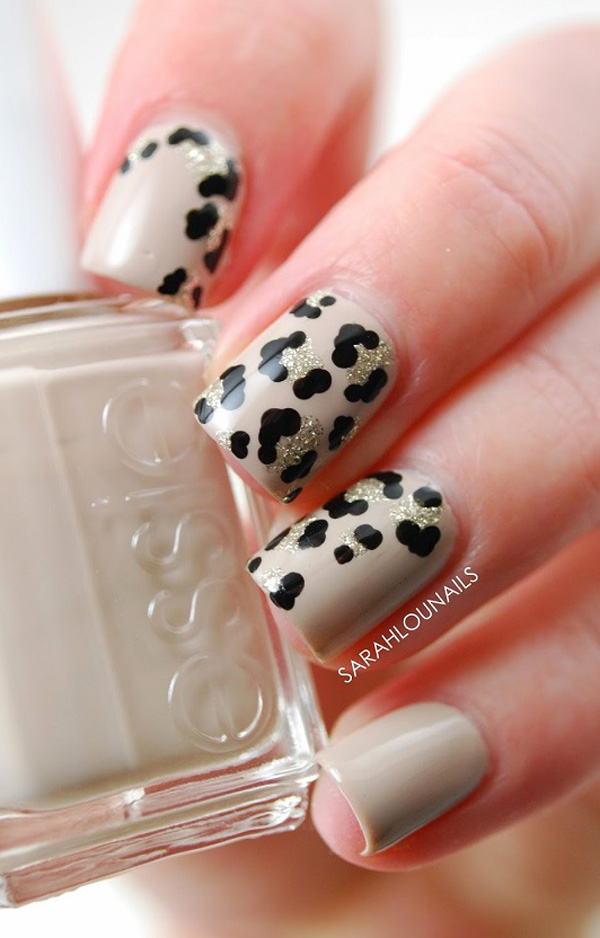 Black and white leopard nail art design. This takes a bit of a departure from the usual two colored leopard print style. Then again the addition of the silver glitter polish makes it work and look beautiful.
