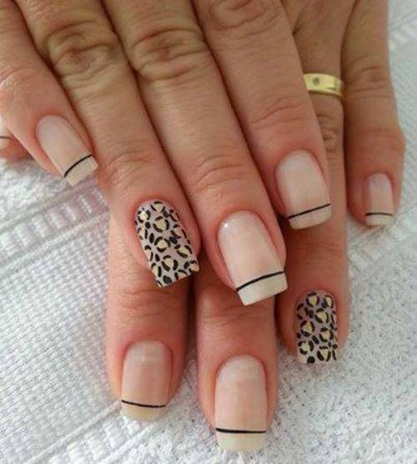 Nude and white leopard nail art design with French tips. A simple and clean looking nail art design that looks wonderful with hints of yellow nail polish on the leopard prints.