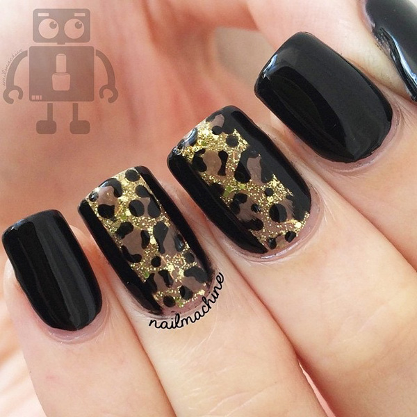 Black and brown leopard nail art design. The brown leopard prints are painted over the sharp black background causing it to look very much visible even from afar. The gold dust sprinkled all over the leopard prints look absolutely elegant.