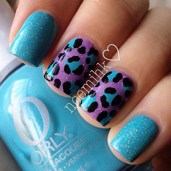 Blue and violet inspired leopard nail art design. This is one of those fresh looking designs that you would want to get for the spring or summer seasons. The frosted nail polish gives a wonderful effect to the design.