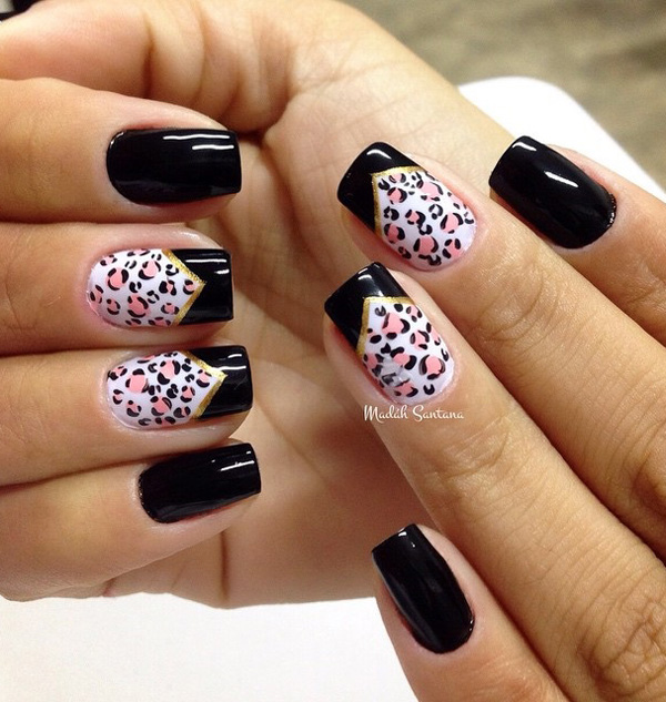 Black and white leopard nail art design with pink leopard prints. A cute and also cool looking design that also has gold metallic as lining for the French tips.