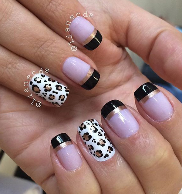 Black and white leopard nail art design with French tips. A simple and cool looking design perfect for your nails. The black French tips also help give an edge to your nails.