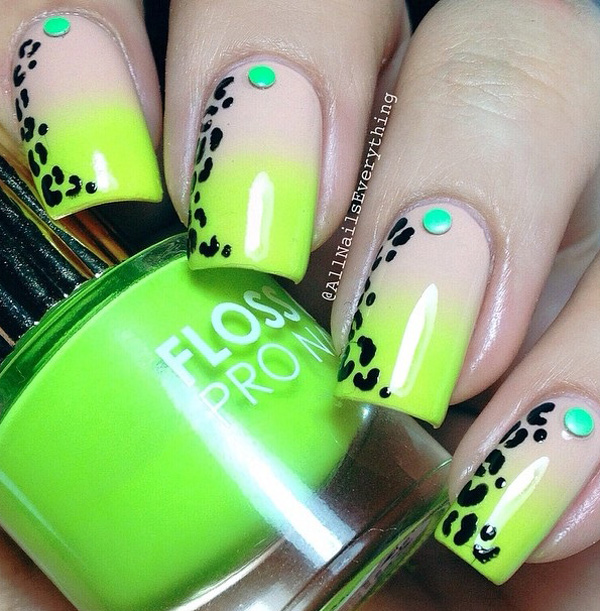 Green inspired leopard nail art design. The gradient theme for the background makes the design look fresh and eye catching. The all black leopard prints also look perfect framing the sides of the nails as the green beads hold the center spots.