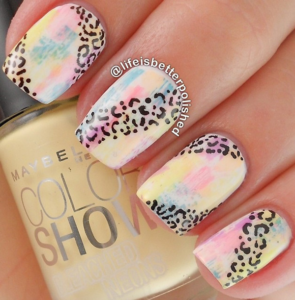 Colorful leopard nail art design. The background of the nail art is done in a paintbrush fashion which gives off light colors that are pleasing to the eyes. The leopard prints are also painted on top as if dancing along the explosion of colors.