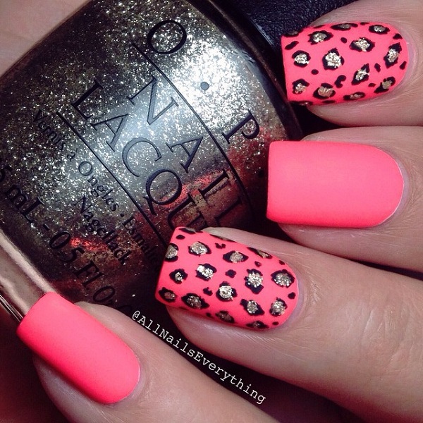 Bright pink and black leopard nail art. This combination is truly an eye catcher. You can see the colors simply burst out and the leopard prints are highlighted by the silver glitter polish for more effect.