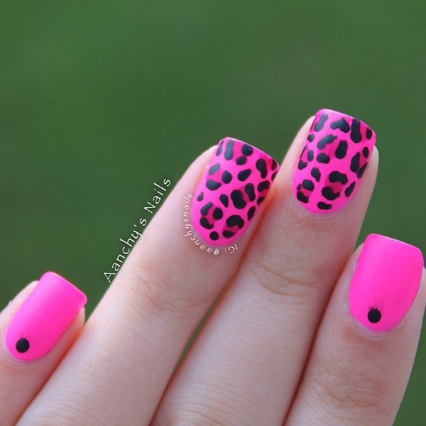 Pink and black leopard nail art design. Pink has always been a hot color and combining it with the black polish only makes it look much more amazing.