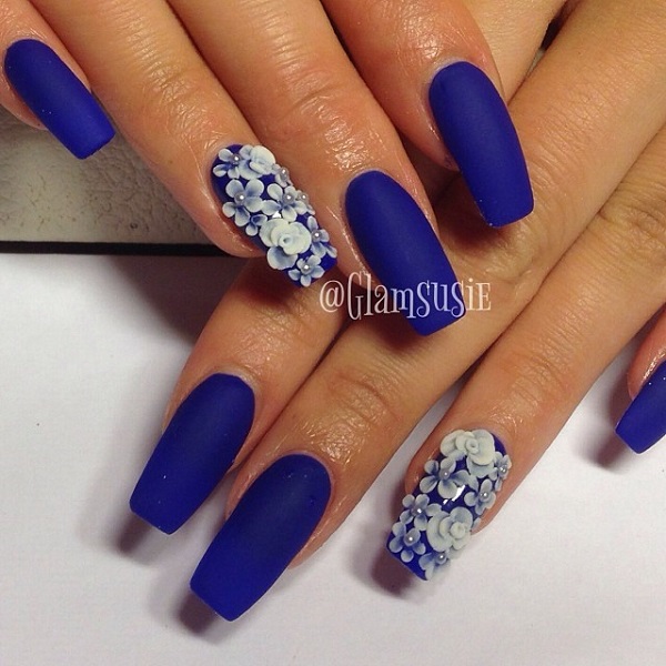 Floral inspired dark blue nail art design. The matte blue nail polish 