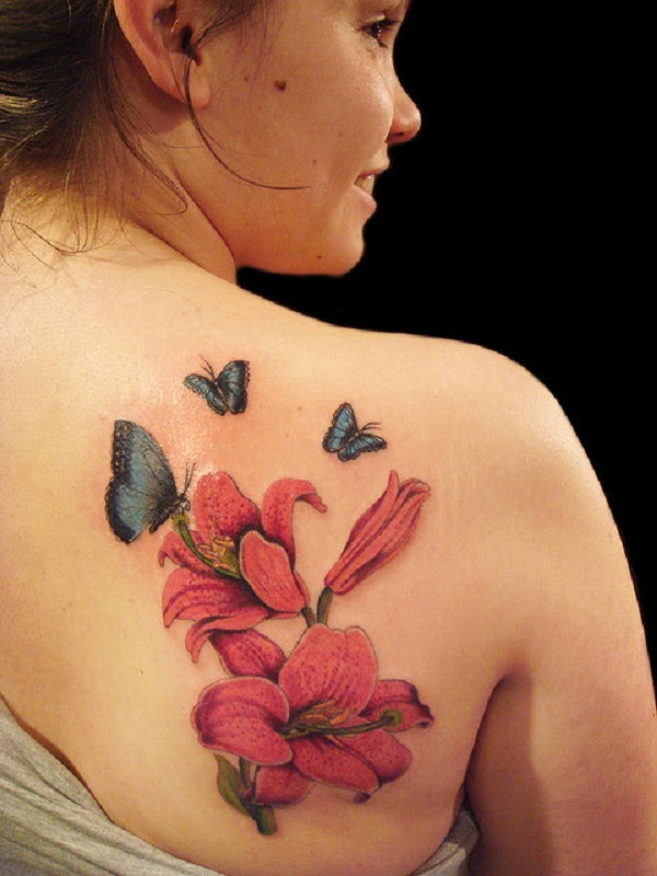 Butterflies with lily flowers tattoo on the back