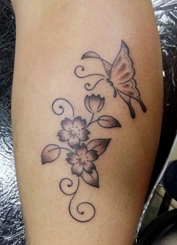 A simple tattoo with wild flowers and butterfly