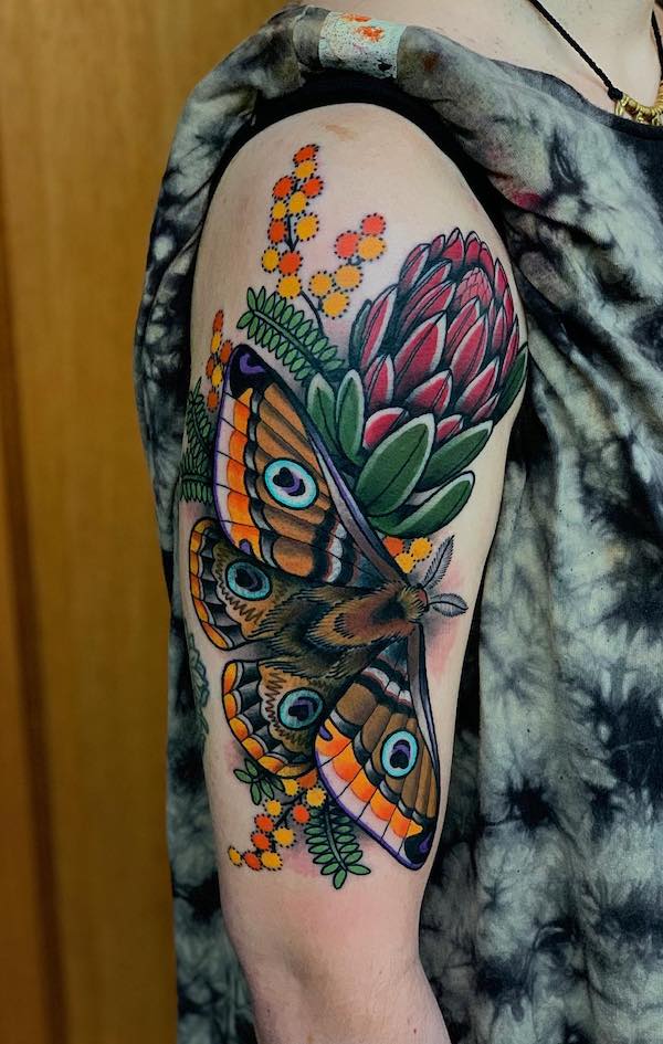 Traditional butterfly and cornflower tattoo