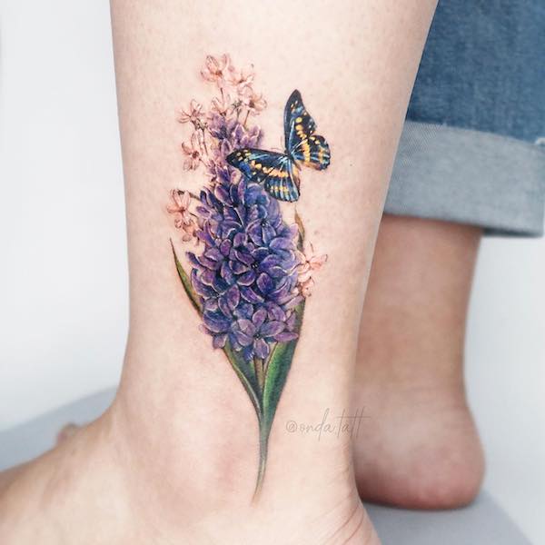 Ankle tattoo of Butterfly and hyacinth flower