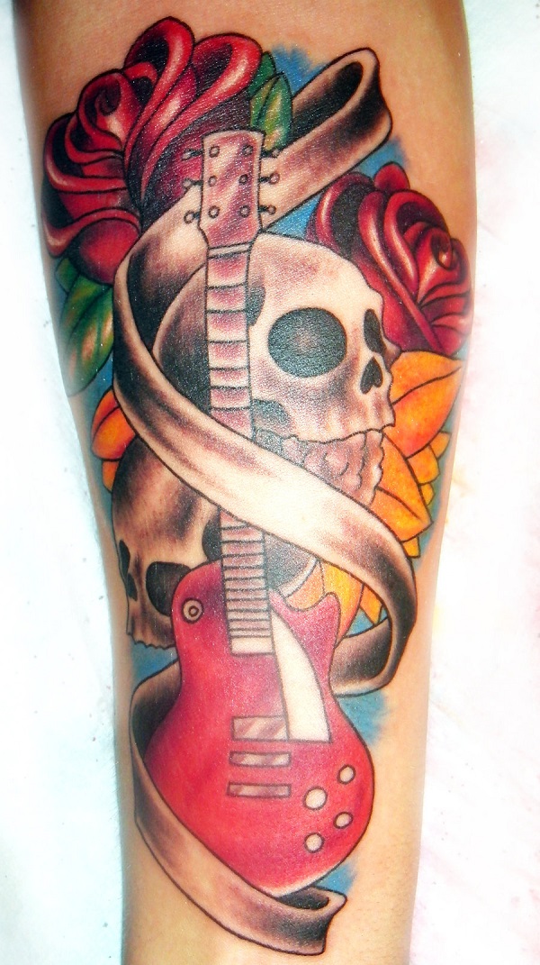 Grey Ink Skull Man Playing Guitar Tattoo On Side