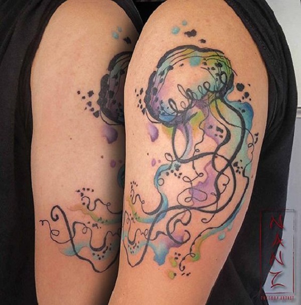 Watercolor jellyfish tattoo on the right side hip