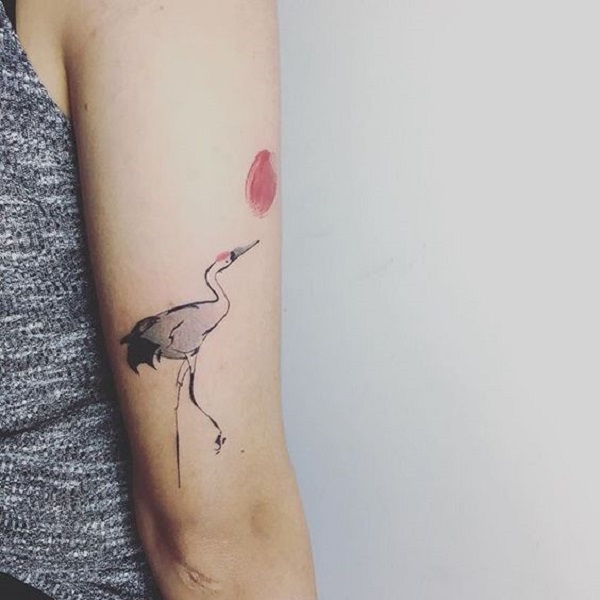 Fine line origami crane tattoo on the ankle